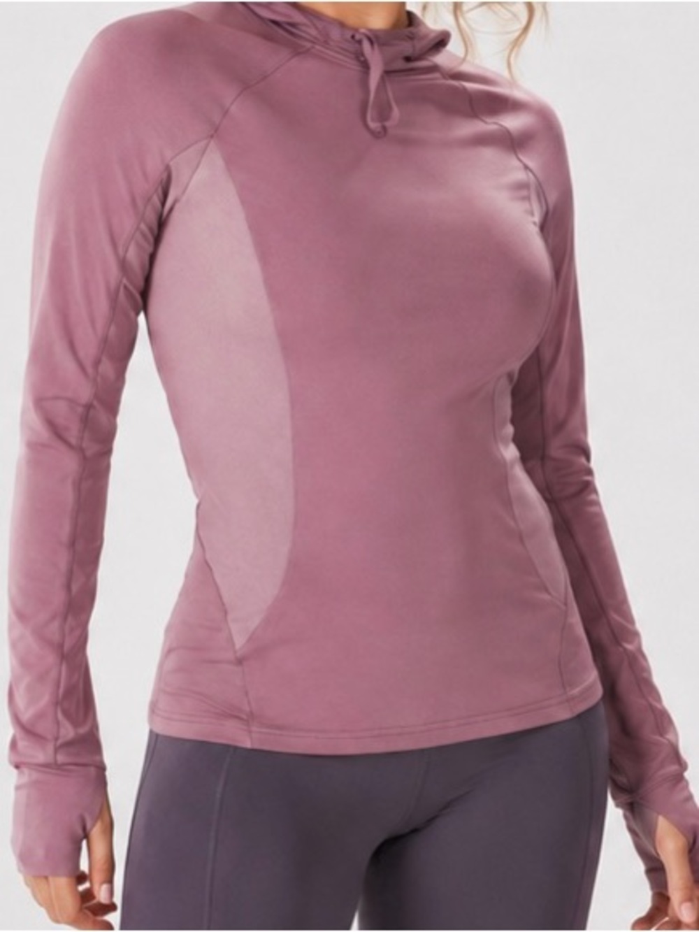 Fabletics mauve athletic hoodie with thumb hole sleeves.